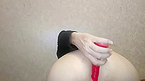 Crossdresser having fun with his dildo