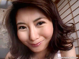 Doe eyed asian MILF gives a handie