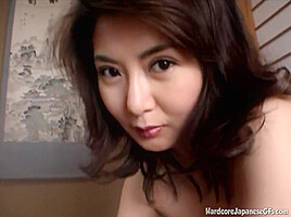 Doe eyed asian MILF gives a handie