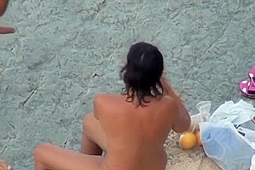 Eating her beaver on the beach