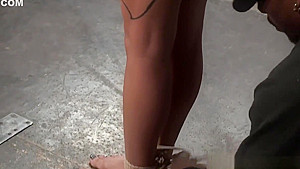 Ebony sub enjoys being hogtied and suspended