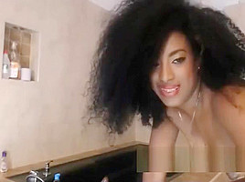 Ebony with curly hair brown dildo rinding on webcam