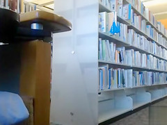 Female student 18+ makes upskirt selfie in library