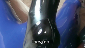 Femdom Girl In Black Latex Makes Heeljob And Piss An Her Rubber Male Slave
