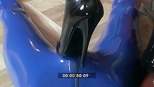 Femdom Girl In Black Latex Makes Heeljob And Piss An Her Rubber Male Slave