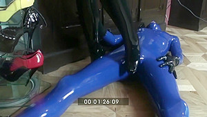 Femdom Girl In Black Latex Makes Heeljob And Piss An Her Rubber Male Slave
