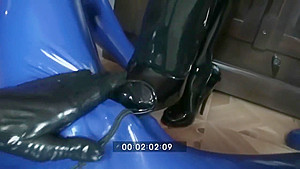 Femdom Girl In Black Latex Makes Heeljob And Piss An Her Rubber Male Slave