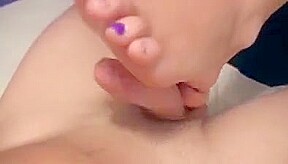 Footjob while TV