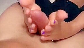 Footjob while TV