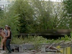 Gagged slut suspended from a bridge