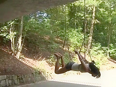 Gagged slut suspended from a bridge