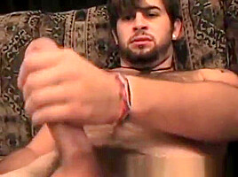 Hairy guy grabs his rock solid cock and masturbates solo