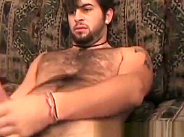 Hairy guy grabs his rock solid cock and masturbates solo