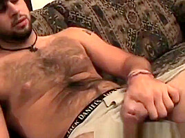 Hairy guy grabs his rock solid cock and masturbates solo