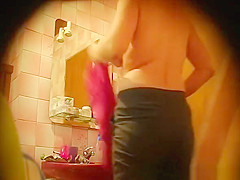 Hairy woman spied in bathroom
