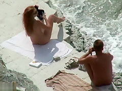 Horny couple on the beach