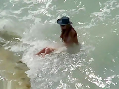 Horny couple on the beach