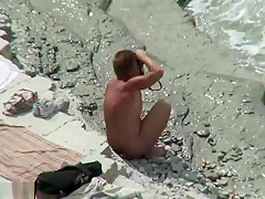 Horny couple on the beach