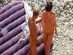 Hot couple having sex in the middle of the beach