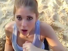 Hot ponytailed girl sucks off her bf at the beach and gets a facial