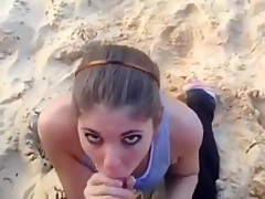 Hot ponytailed girl sucks off her bf at the beach and gets a facial