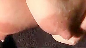 Hucow udders hanging and dripping milk