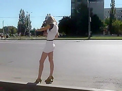 Hypnotic ass under a short white skirt