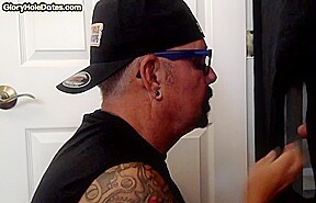 Inked arm gloryhole DILF sucks BFs hard cock at home
