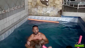 Insatiable blonde is sucking dick and getting fucked at the same time, next to the swimming pool