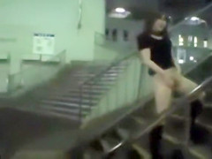 Japanese doll masturbates in public for a crowd