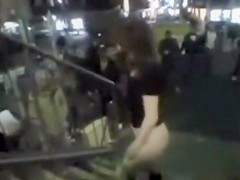 Japanese doll masturbates in public for a crowd