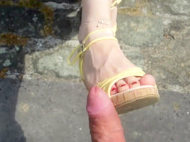 Jerking off on a pair of feet in high heels