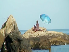 Kinky couple having naughty fun on a nice secluded beach