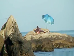 Kinky couple having naughty fun on a nice secluded beach