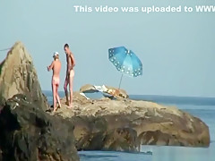 Kinky couple having naughty fun on a nice secluded beach