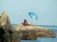 Kinky couple having naughty fun on a nice secluded beach