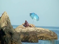 Kinky couple having naughty fun on a nice secluded beach