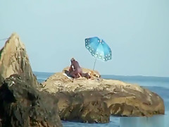 Kinky couple having naughty fun on a nice secluded beach