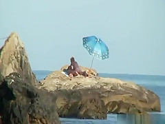 Kinky couple having naughty fun on a nice secluded beach