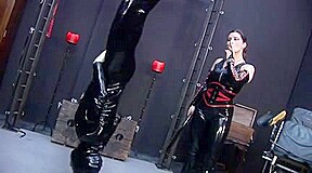 Latex male slut sucks big dildo in spandex porn video