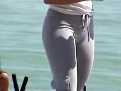 Long haired cutie with big candid ass spied on the beach 01zr
