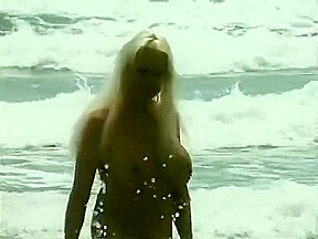 Long-haired blonde with huge boobs saves dude from nasty hard-on