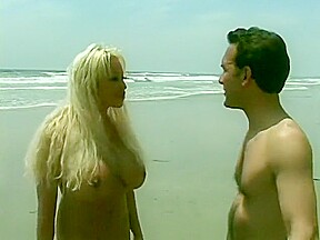 Long-haired blonde with huge boobs saves dude from nasty hard-on
