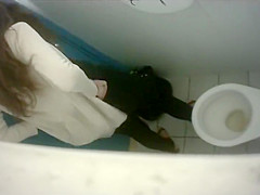 Long-haired brunette with a bubble butt takes a quick pee in the college restroom