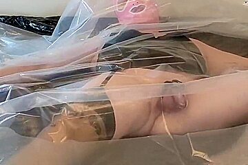 Masked And Caged Sissy Crossdresser Fulfilling Her Plastic Fetish