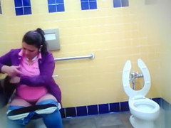 Mature Mexican woman goes pee in a public bathroom