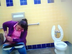 Mature Mexican woman goes pee in a public bathroom