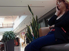 Mature woman sitting on mall bench