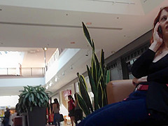 Mature woman sitting on mall bench
