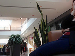Mature woman sitting on mall bench